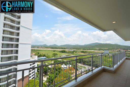Spacious balcony with scenic mountain and city views