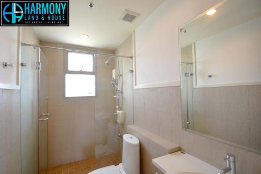 Spacious modern bathroom with glass shower stall