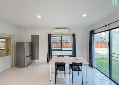 Modern kitchen with dining area and access to the garden