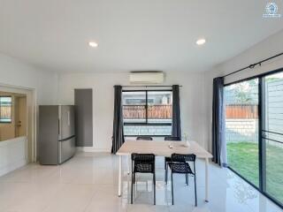 Modern kitchen with dining area and access to the garden