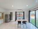 Modern kitchen with dining area and access to the garden