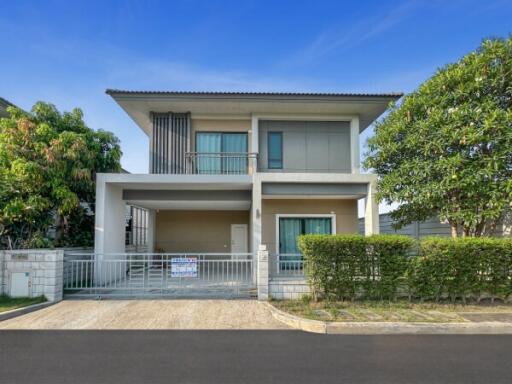 Modern two-story house with landscaped front yard