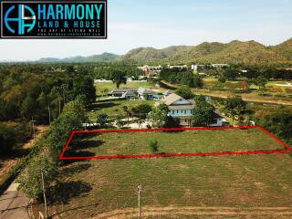 Aerial view of a residential property with house and large garden