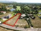 aerial view of large vacant land plot suitable for development with surrounding scenery