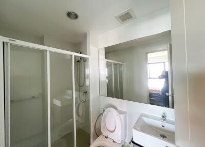Modern bathroom with shower cabin and pedestal sink