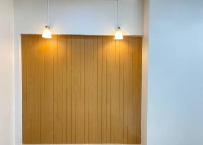 Modern interior with wooden paneling and pendant lights