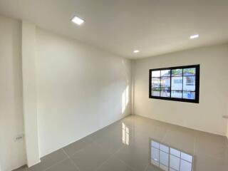 Spacious and well-lit living room with large window