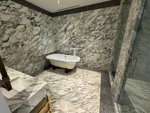 Luxurious marble bathroom with elegant freestanding bathtub