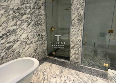 Luxurious marble bathroom with freestanding tub and separate shower