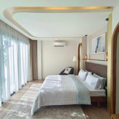 Modern bedroom with natural light and elegant design