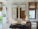 Modern bathroom with dual sinks and stylish fixtures