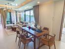 Spacious and well-lit living room with dining area and access to garden