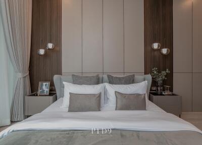 Modern bedroom with elegant decor including plush bedding and stylish furnishings