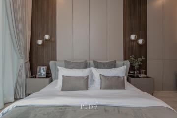 Modern bedroom with elegant decor including plush bedding and stylish furnishings