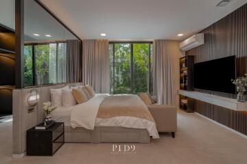 Modern master bedroom with large windows and stylish interior design
