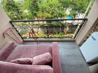 Comfortable balcony with plush seating and scenic view