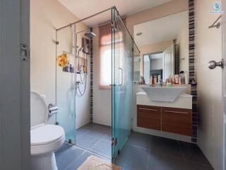 Modern bathroom with walk-in shower and stylish vanity