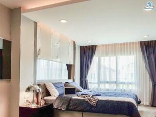 Elegant modern bedroom with large window and stylish decor