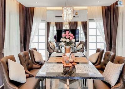 Elegant dining room with luxurious decor and a large chandelier