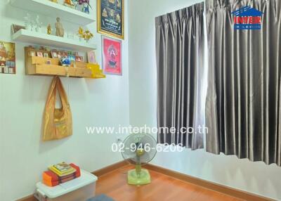 Well-kept bedroom with spiritual decor and wooden furnishings