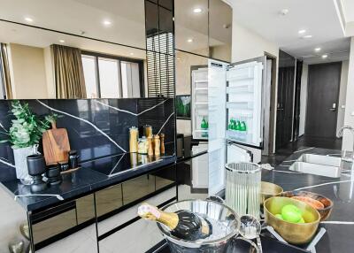 Modern kitchen with open refrigerator and elegant interior