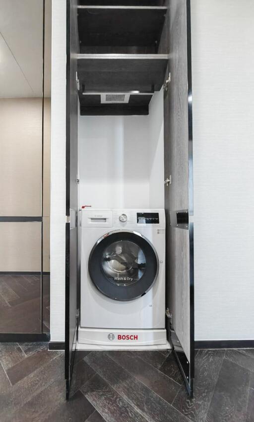 Modern in-built laundry area with Bosch washing machine