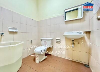 Clean and well-maintained bathroom with neutral tiles