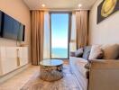 Spacious living room with ocean view, modern furnishings, and ample natural light