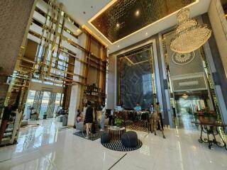 Luxurious hotel lobby with high ceilings and elegant decor