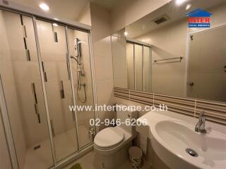 Modern bathroom interior with shower and sink
