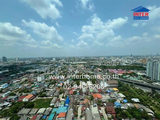 Aerial view of a vibrant cityscape with visible residential and commercial buildings