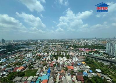 Aerial view of a vibrant cityscape with visible residential and commercial buildings