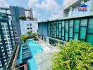 Luxurious outdoor swimming pool surrounded by apartment buildings