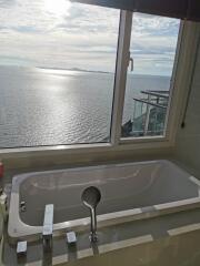 Elegant bathroom with ocean view through large window