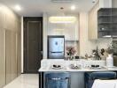 Modern kitchen with integrated dining area featuring stylish decor and appliances