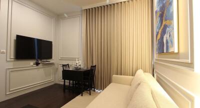 Elegant living room with modern dining area, neutral color palette