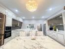 Modern kitchen with marble countertops and elegant lighting