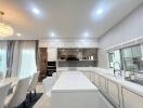 Spacious modern kitchen with integrated dining area