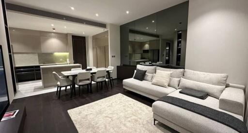 Modern and spacious living room with dining area and open kitchen