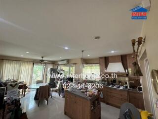 Spacious living area with kitchenette and ample natural light