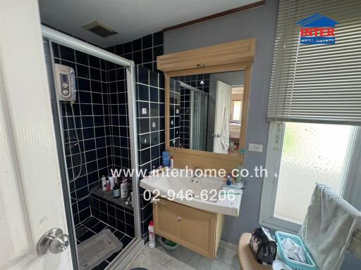 Compact bathroom with modern amenities and frosted window