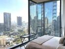 Modern bedroom with large windows overlooking city skyline