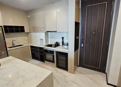 Modern kitchen interior with marble countertops and built-in appliances