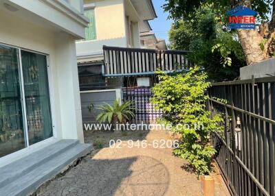 Suburban house exterior with gated entrance