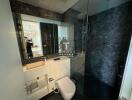 Modern bathroom with elegant dark marble walls and luxurious fixtures