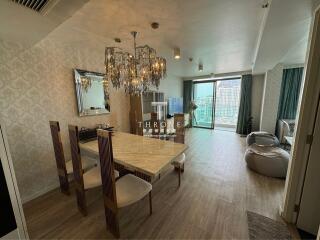 Spacious dining room with modern chandelier and large windows