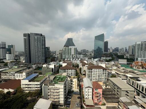 Panoramic view of a bustling cityscape with modern skyscrapers and traditional buildings