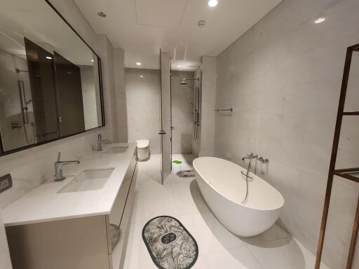 Modern spacious bathroom with white fixtures