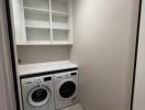 Modern laundry room with built-in appliances
