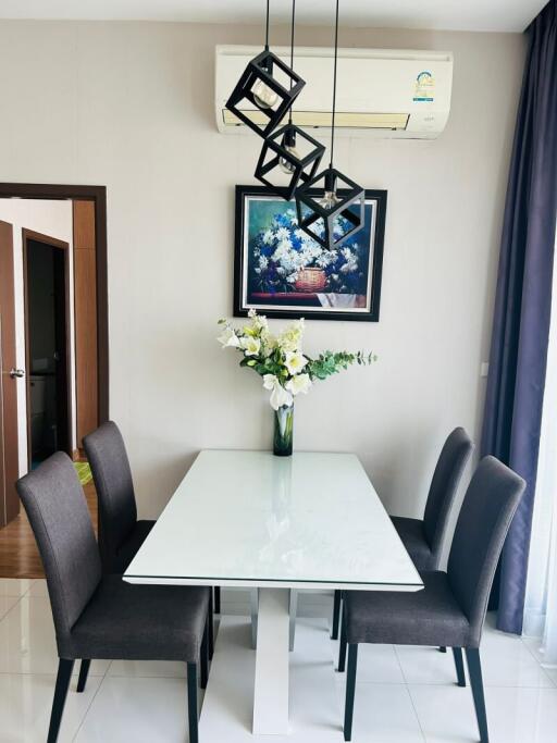 Modern dining room with stylish furniture and wall art